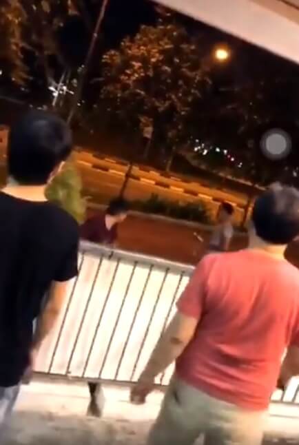 bizarre fight sees man playing recorder in front of police while another man wields potted plant world of buzz