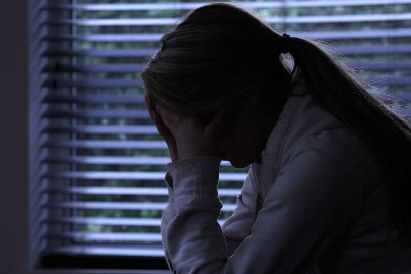 0 Pay Profile Of A Girl With A Ponytail Sitting Hands Covering Her Face Silhouette