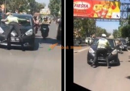 aksi menegangkan seorang polisi lalu lintas atau polantas saat menjalankan tugasnya terekam kamera