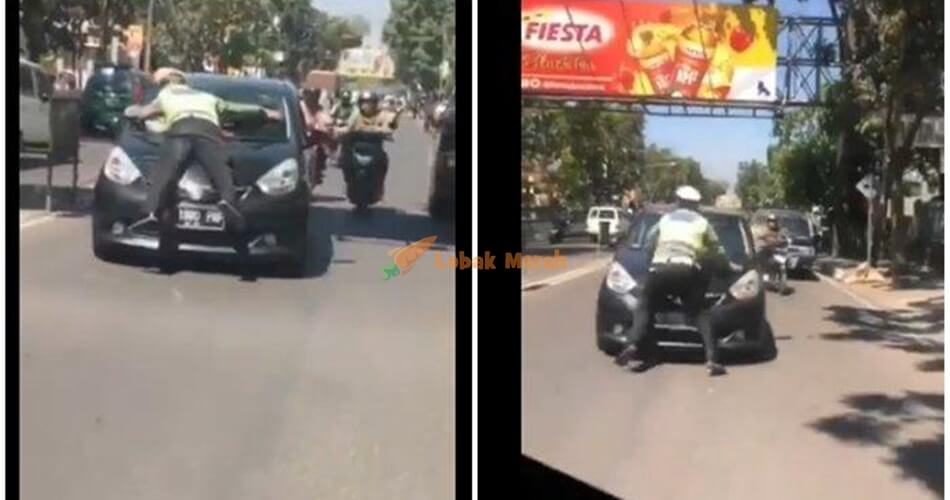aksi menegangkan seorang polisi lalu lintas atau polantas saat menjalankan tugasnya terekam kamera
