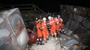 Rescue Workers Move Casualty On The Site Where A Hotel Being Used For The Coronavirus Quarantine Collapsed As The Country Is Hit By The Novel Coronavirus In The Southeast Chinese Port City Of Quanz 2