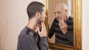 Ageing Man In Mirror