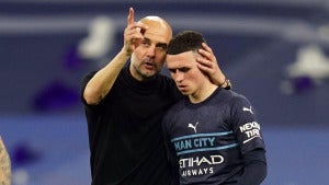 Manchester City manager Pep Guardiola consoles Phil Foden