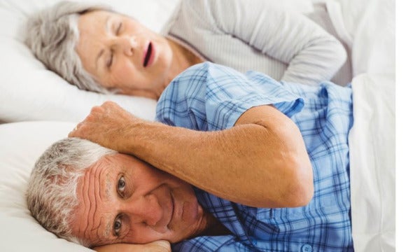 Senior Man Covering Her Ears While Man Snoring Picture 768 E1661569954685