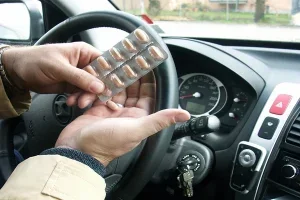 Depositphotos 8355990 Driver Holding Pills In Hand