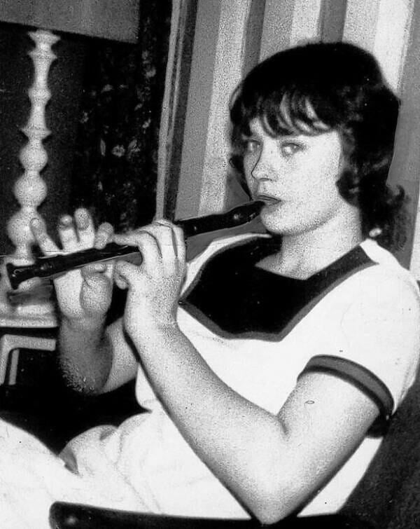 child killer playing flute