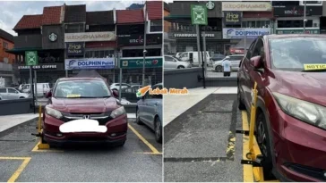 kereta kena clamp tayar terkeluar dari kotak parkir