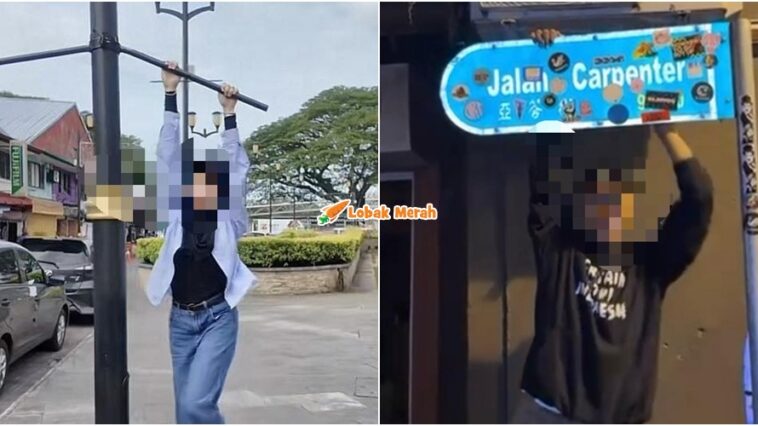 panjat papan tanda jalan DBKU